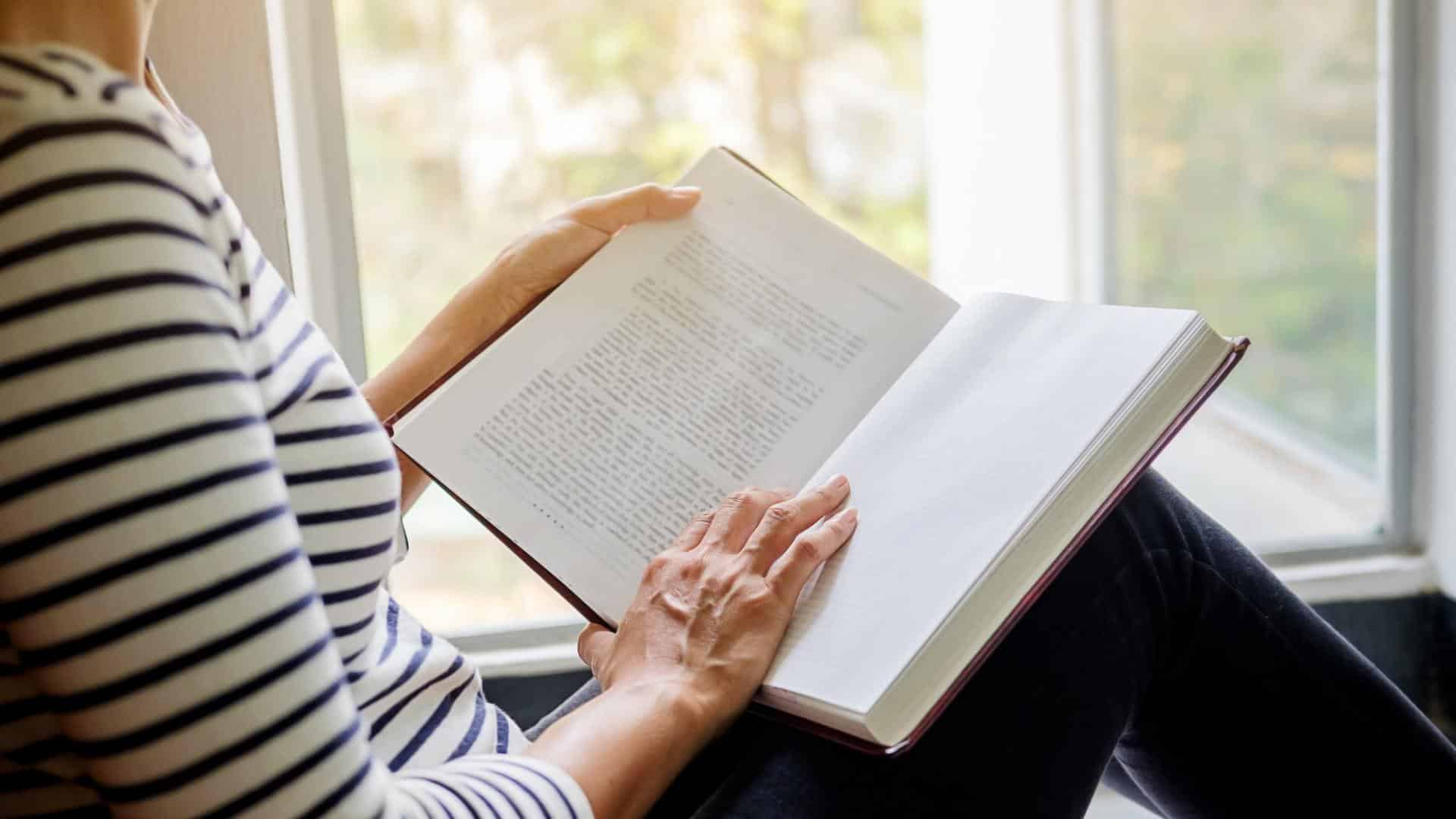 A woman reading a book in an inpatient facility